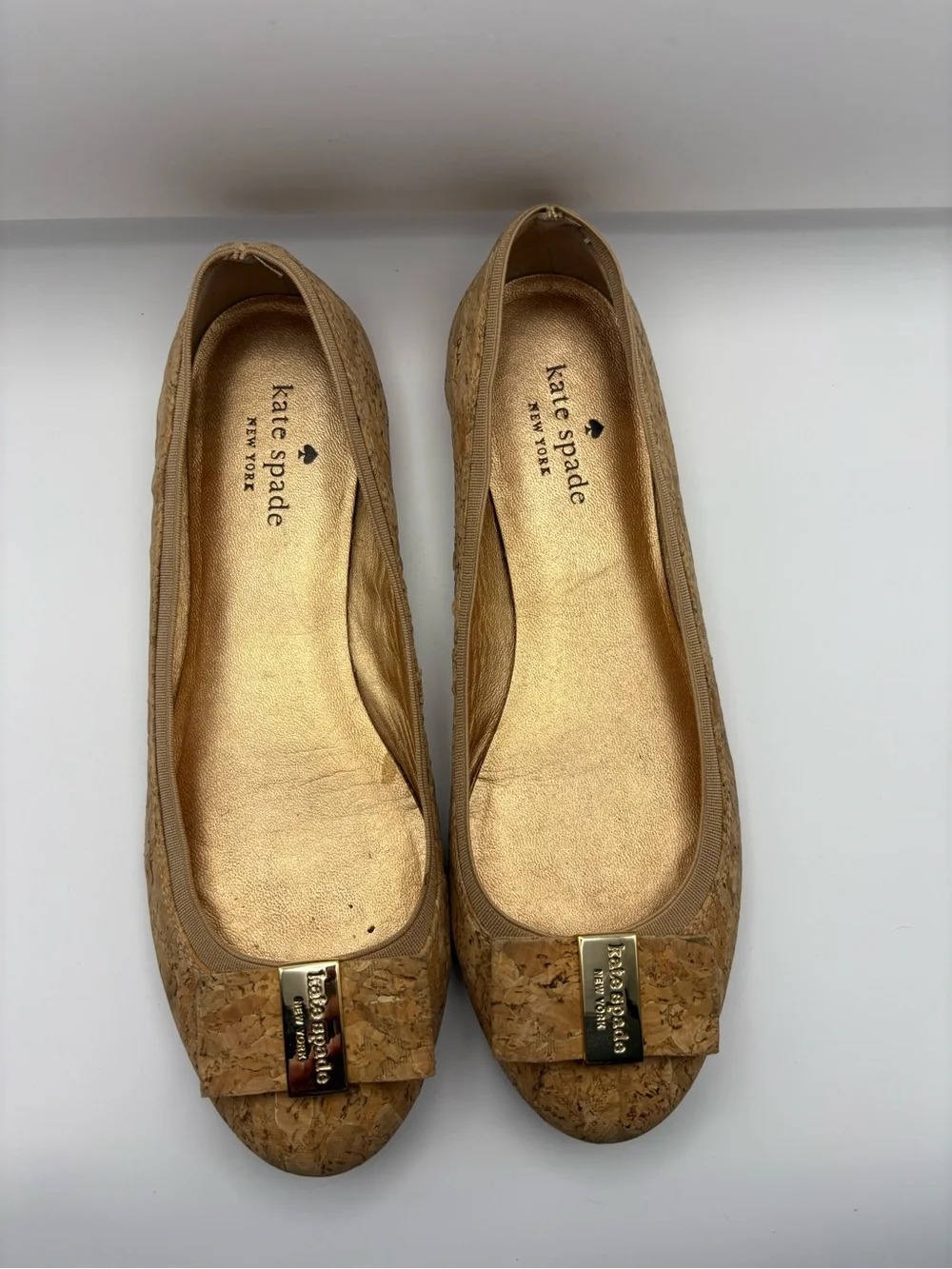 kate spade cork bow flats in tan with gold plaque